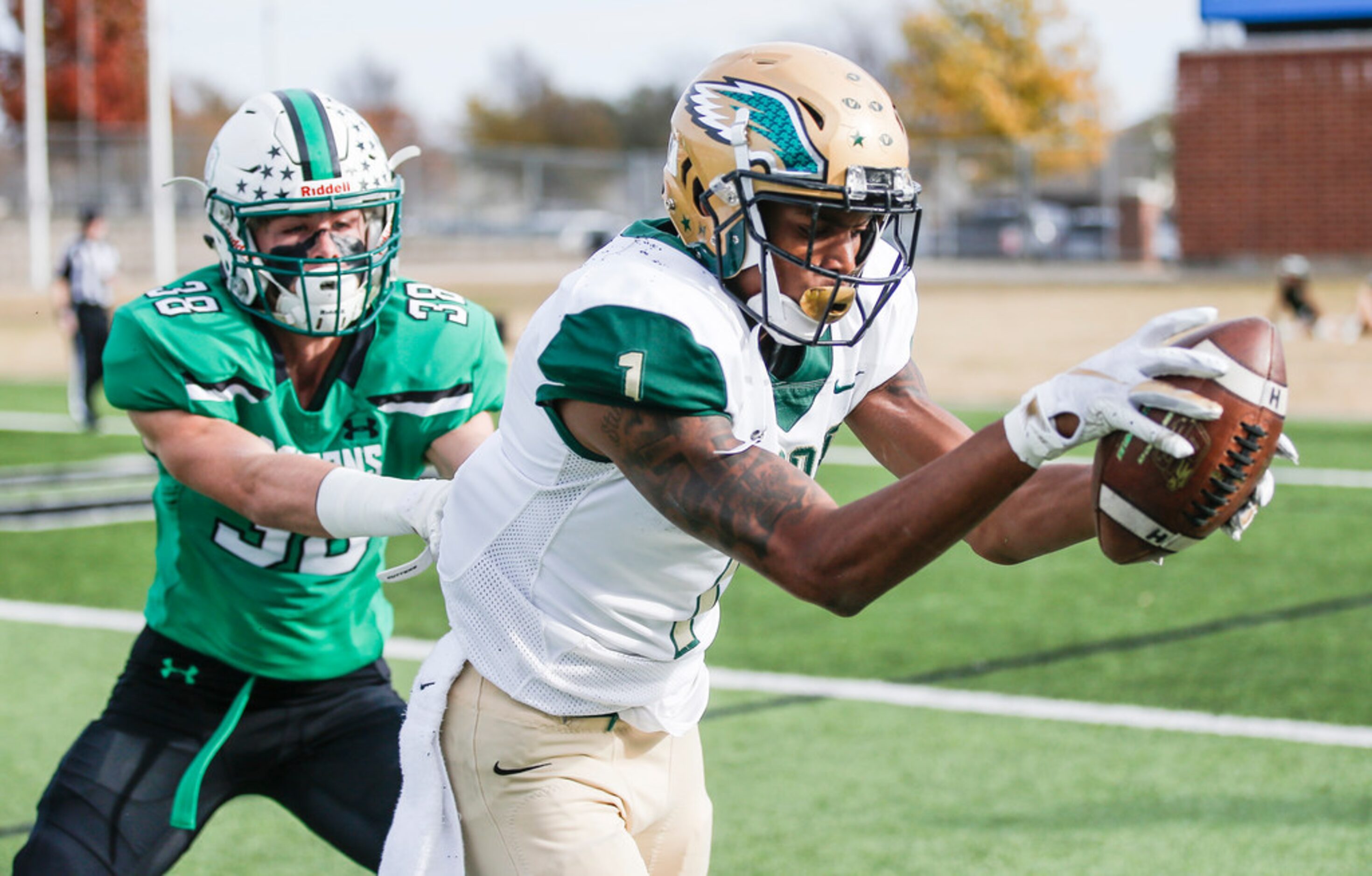 TXHSFB DeSoto senior wide receiver Vontae Shenault (1) catches a pass as Southlake Carroll...