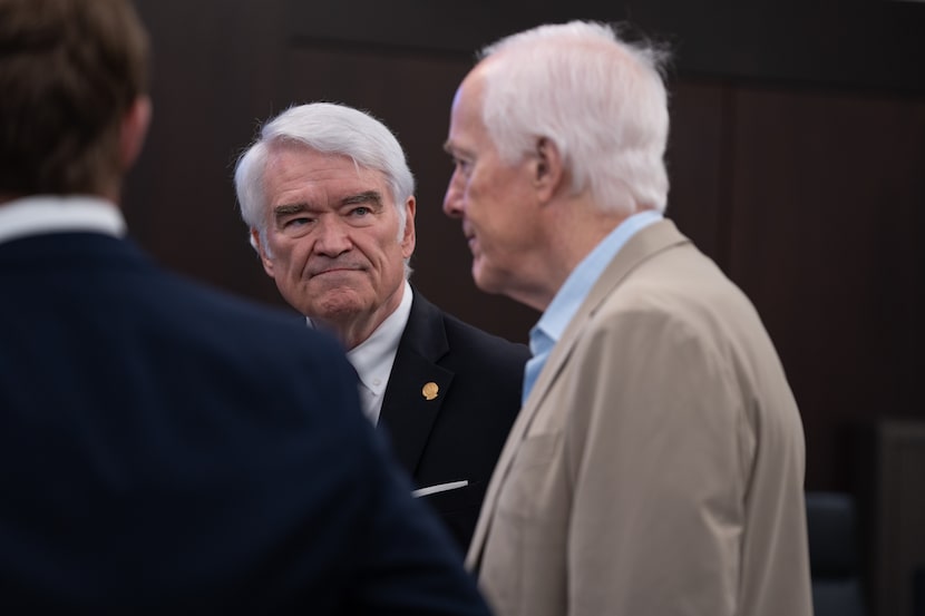 Chief Justice Nathan Hecht (left) speaks with U.S. Sen. John Cornyn after a roundtable...