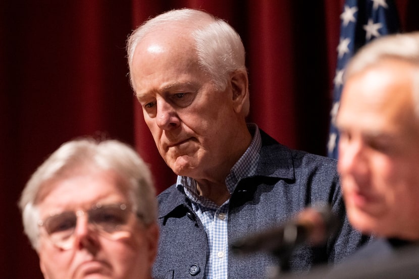 Republican U.S. Sen. John Cornyn of Texas (center) co-wrote, with Sen. Chris Murphy,...