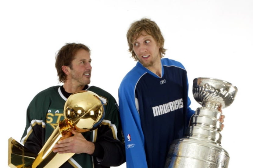 (Left to right)  Dallas Stars'  Mike Modano holds the NBA's Larry O'Brien Trophy and and...