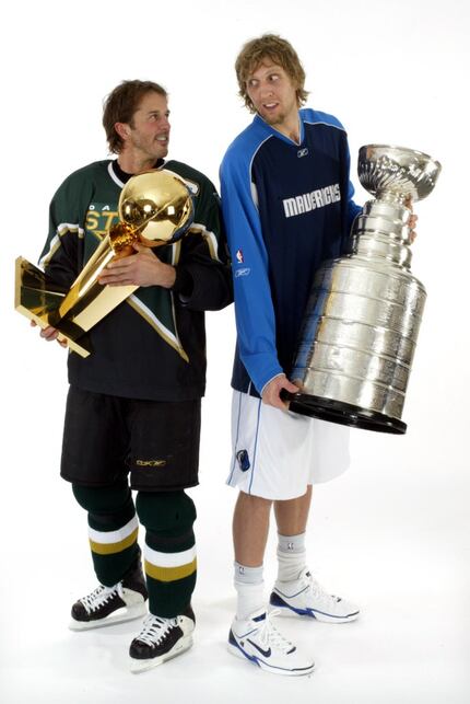 (Left to right)  Dallas Stars'  Mike Modano holds the NBA's Larry O'Brien Trophy and and...