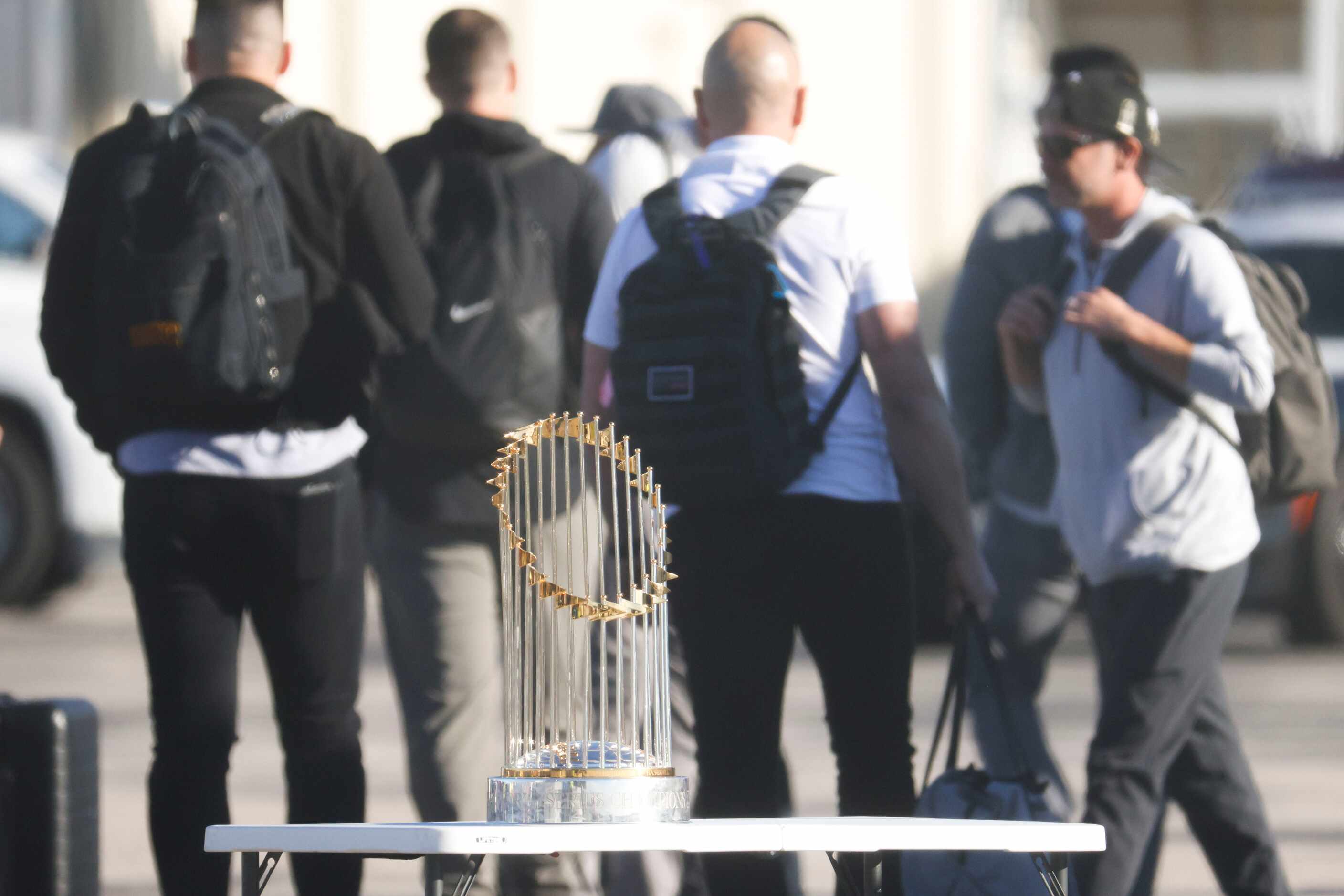 The Commissioner's Trophy remains on the table as Texas Rangers arrive at Dallas Love Field...