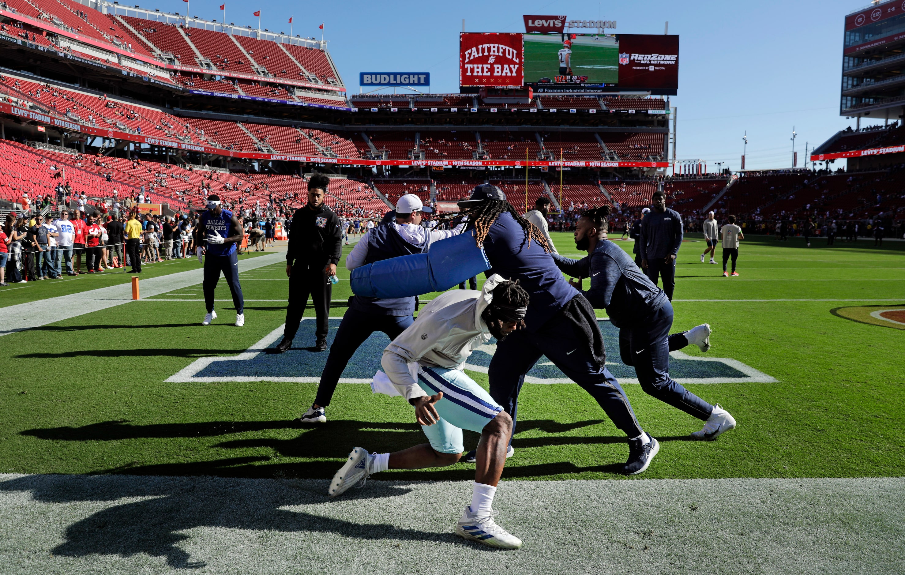 The Dallas Cowboys defensive lineman runs through drills during pregame warmups before...