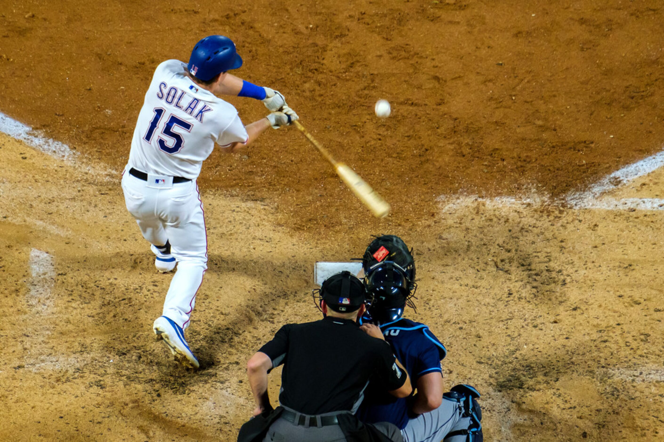 Texas Rangers designated hitter Nick Solak (15) hits a 2-run home run during the fourth...