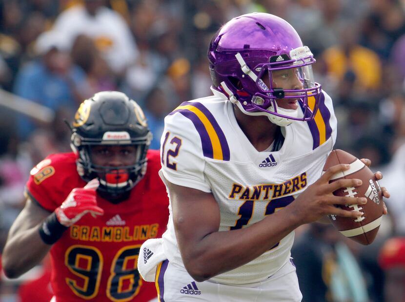 Prairie View A&M quarterback Jalen Morton (12) rolls out of the pocket during the State Fair...