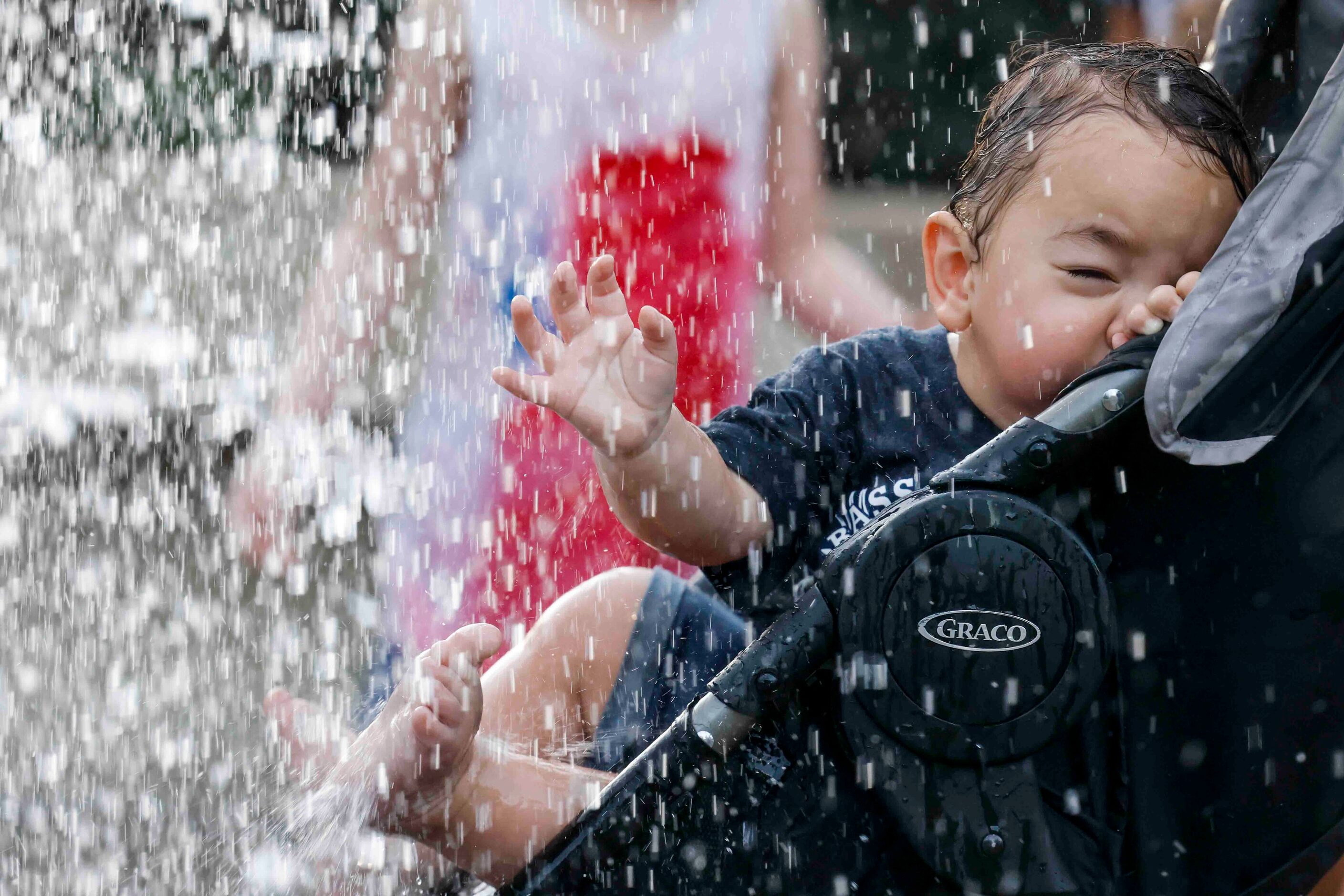 Marcelo Naumann, 1, reacts as his father Joe (not in the photo) take him for a ride in a...