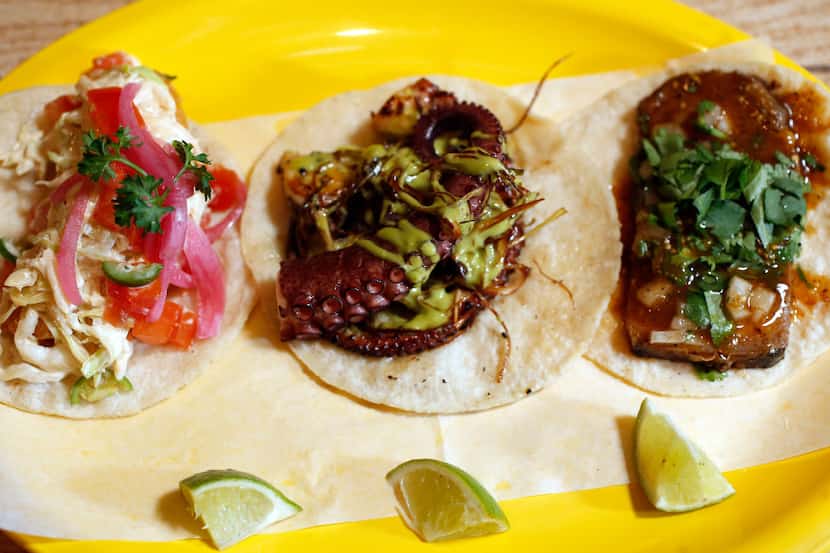 Revolver Taco Lounge's pulpo (octopus) taco, center, is featured at the beginning of the...