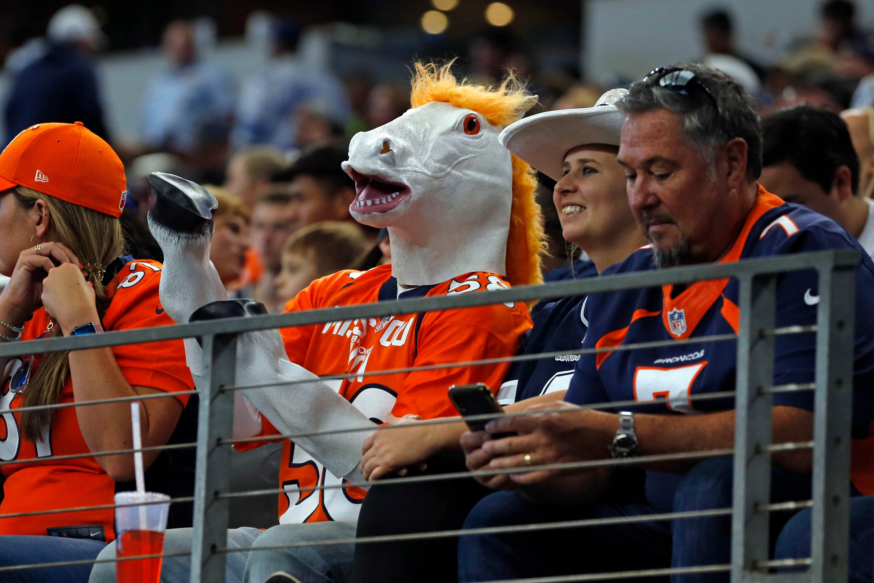 A Denver fan goes full bronco in the stands during the second half of a NFL football game...