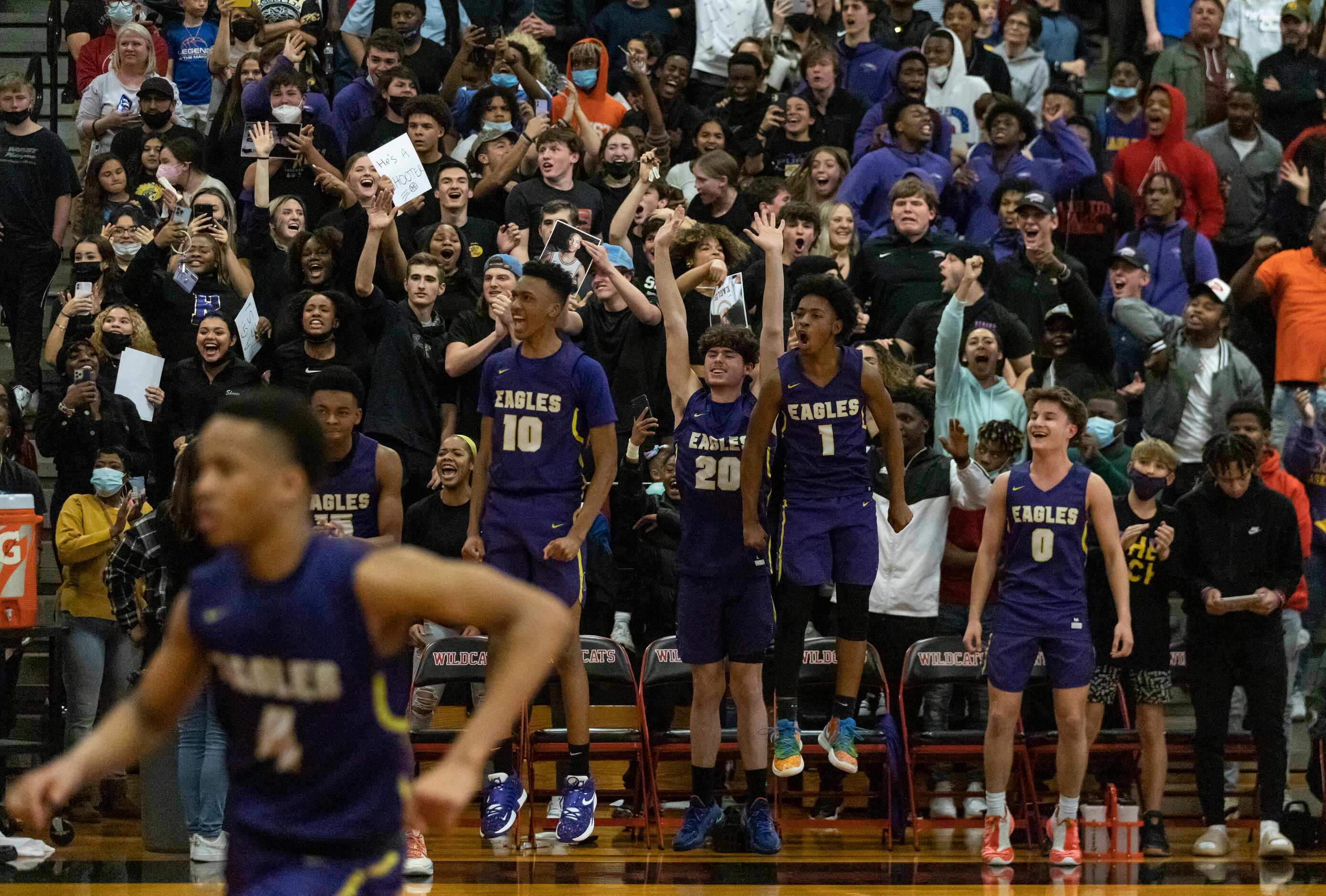 Richardson High School players react as the team scores in the final moments of the fourth...