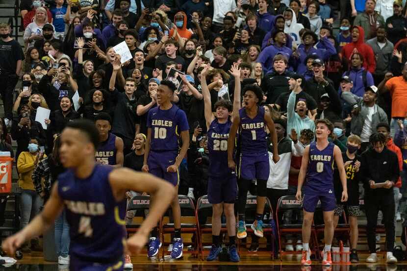 Richardson High School players react as the team scores in the final moments of the fourth...