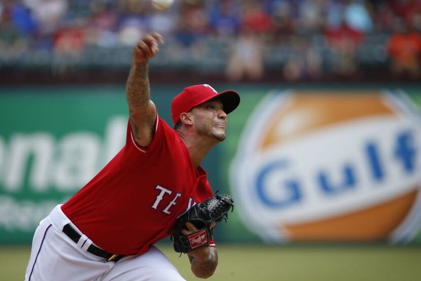 Texas Rangers relief pitcher Matt Bush (51) pitches against Houston Astros during their game...