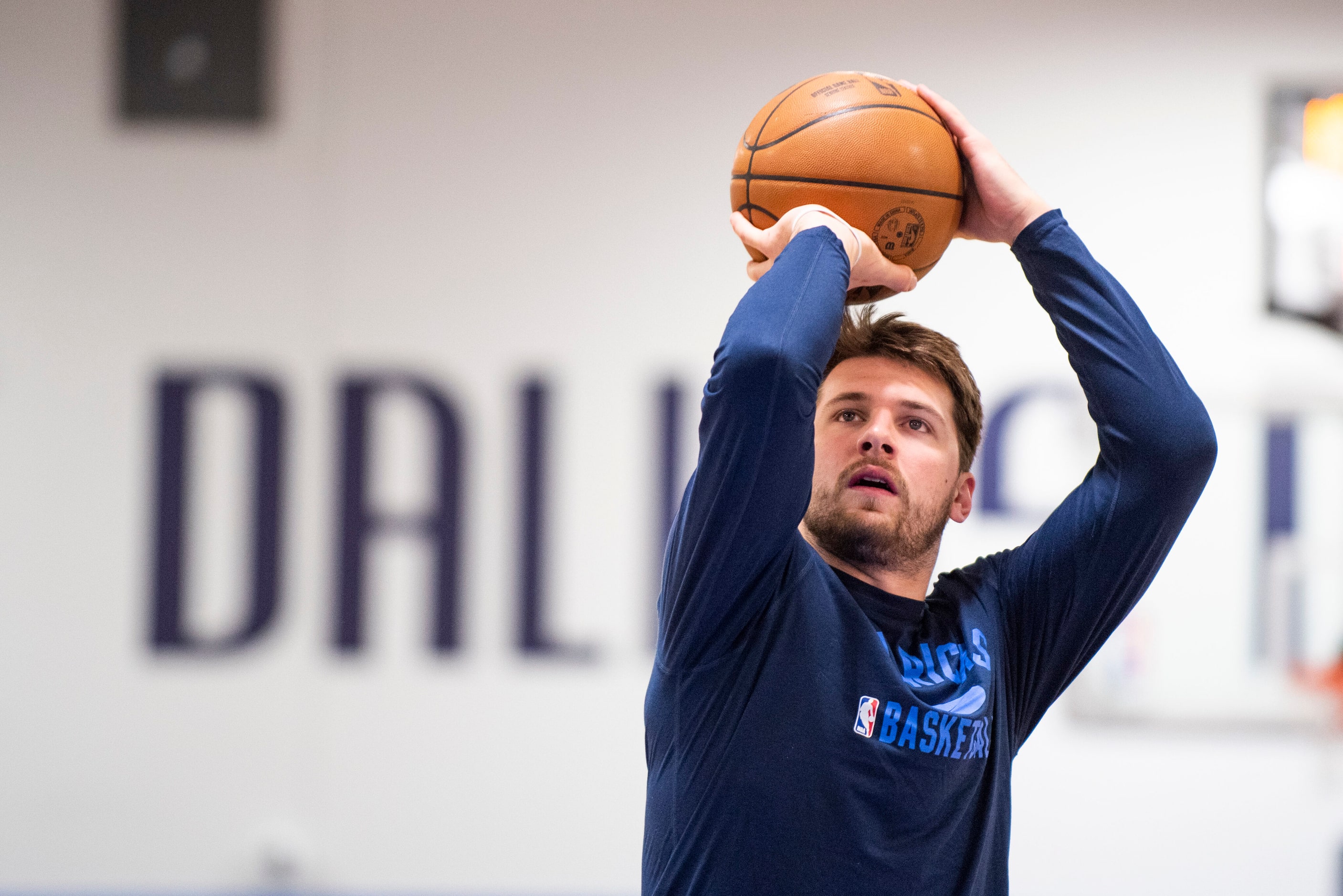 Dallas Mavericks point guard Luka Doncic (77) shoots free throws while practicing at the...