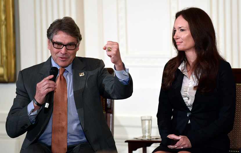 Energy Secretary Rick Perry, left, sitting next to Brooke Rollins, President and Chief...