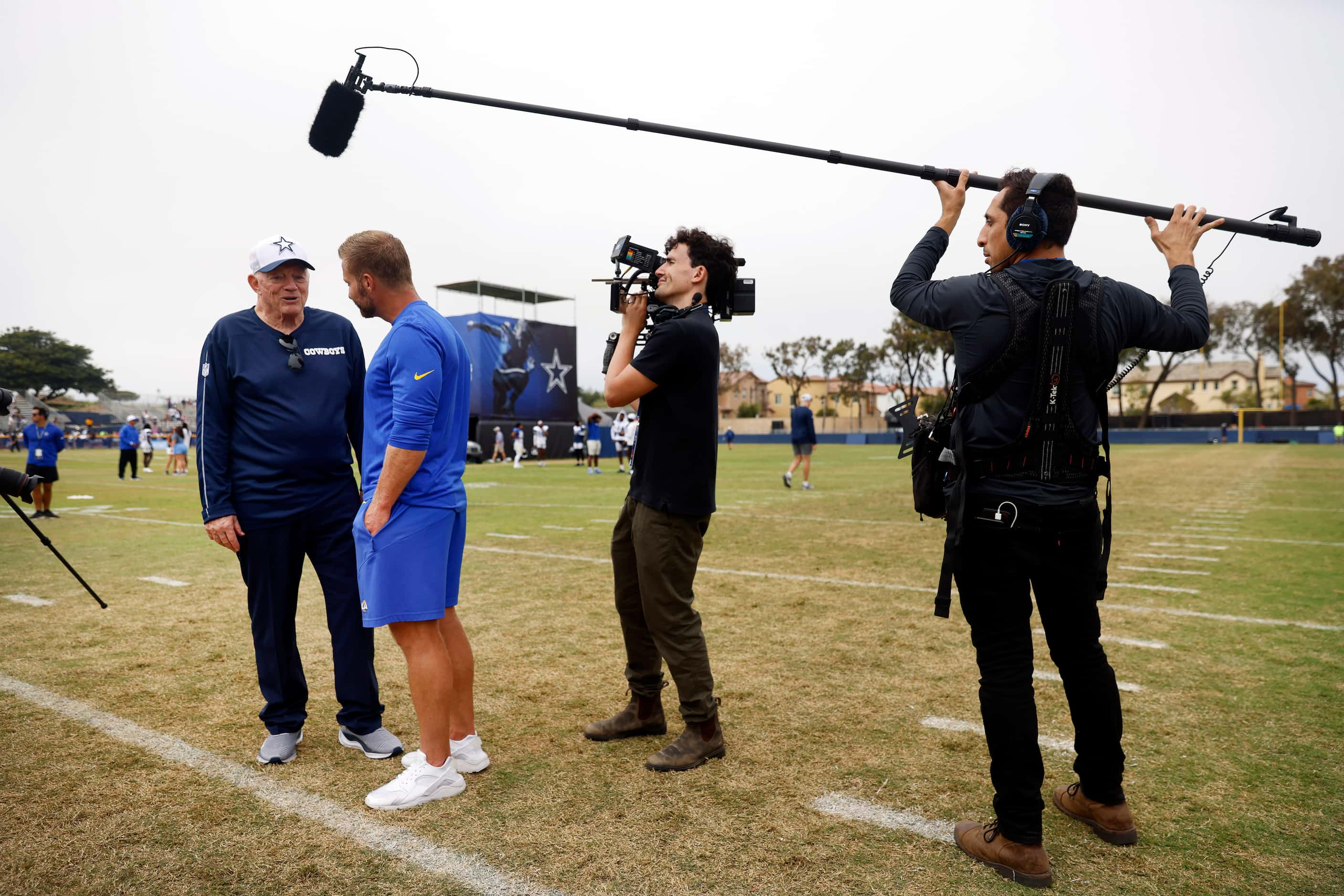 Dallas Cowboys owner Jerry Jones visits with Los Angeles Rams head coach Sean McVay as a...