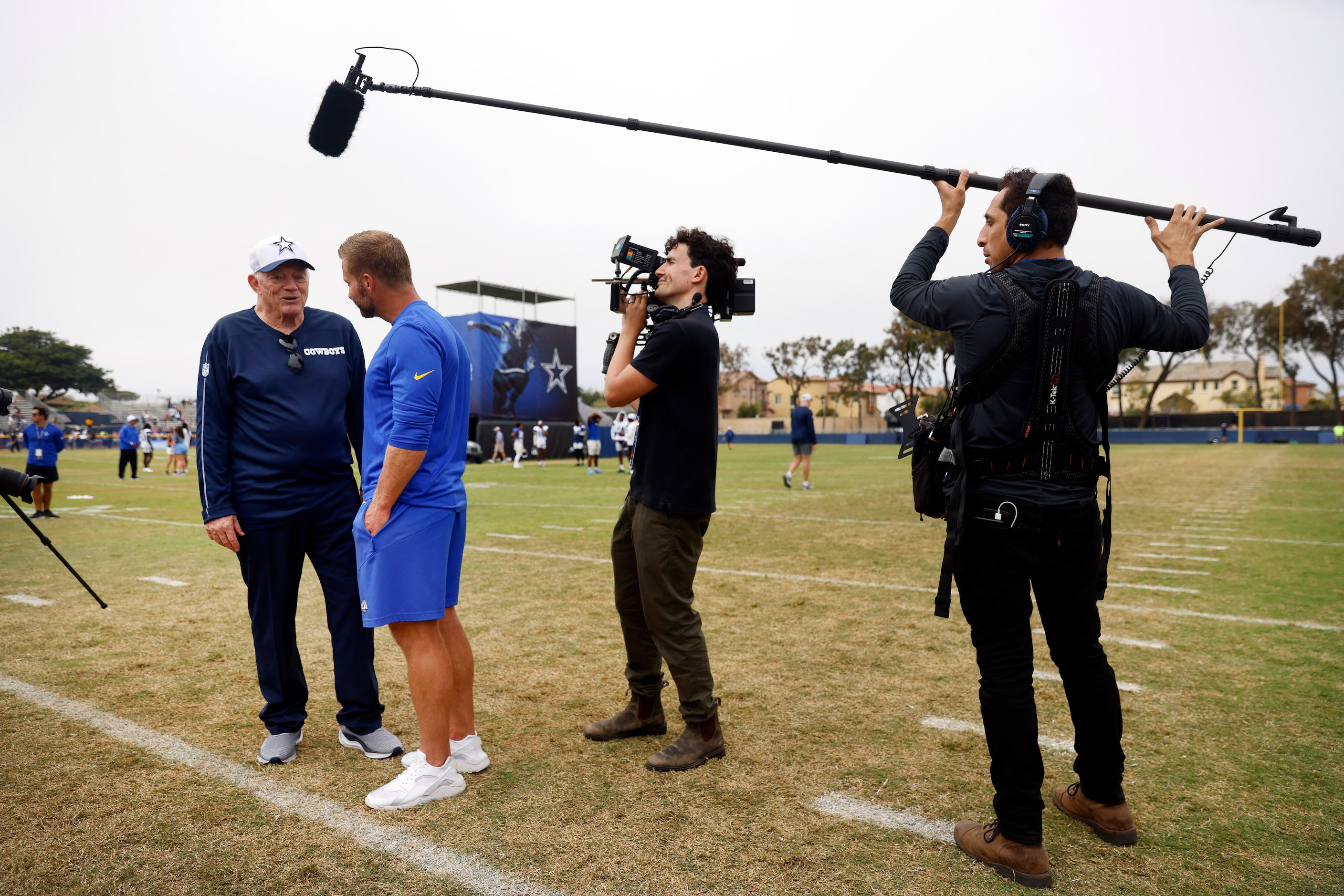 Dallas Cowboys owner Jerry Jones visits with Los Angeles Rams head coach Sean McVay as a...