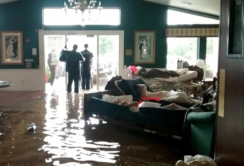 Residents lay on sofas in August 2017 waiting to be evacuated from the Cypress Glen senior...