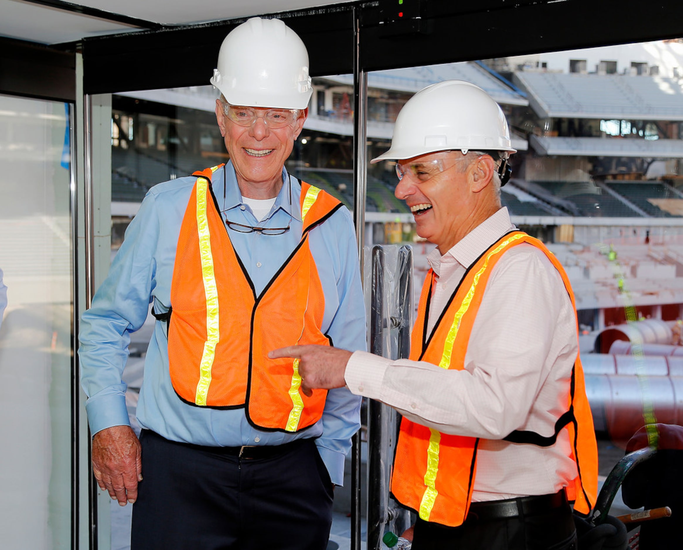 Texas Rangers co-owner Ray Davis (left) shares a laugh with MLB commissioner Rob Manfred who...