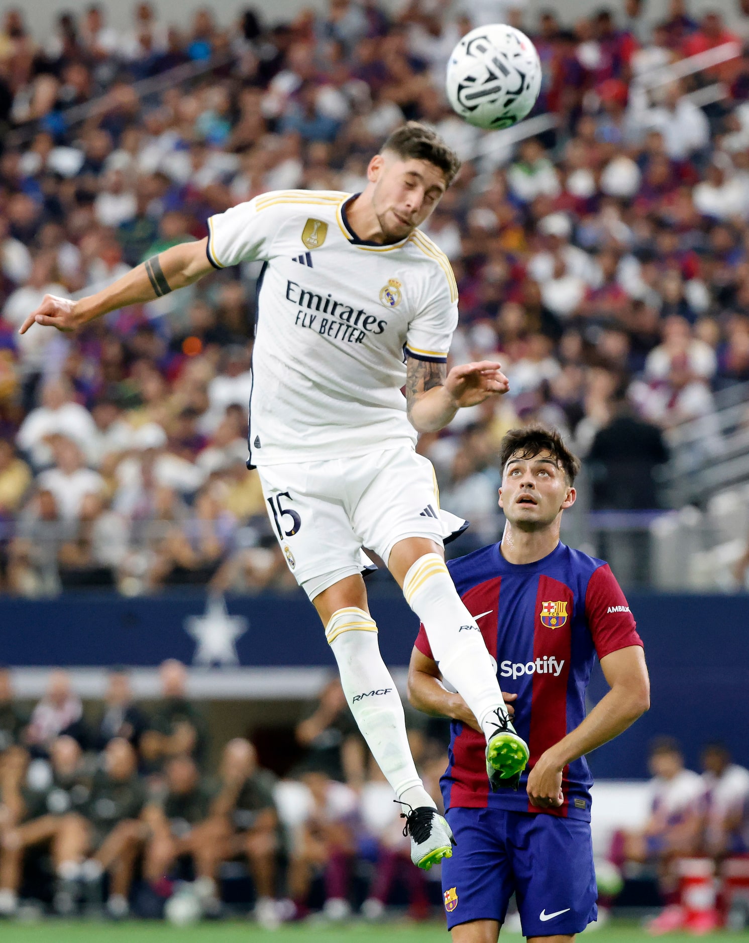 Real Madrid midfielder Federico Valverde (15) heads the ball toward the goal during the...