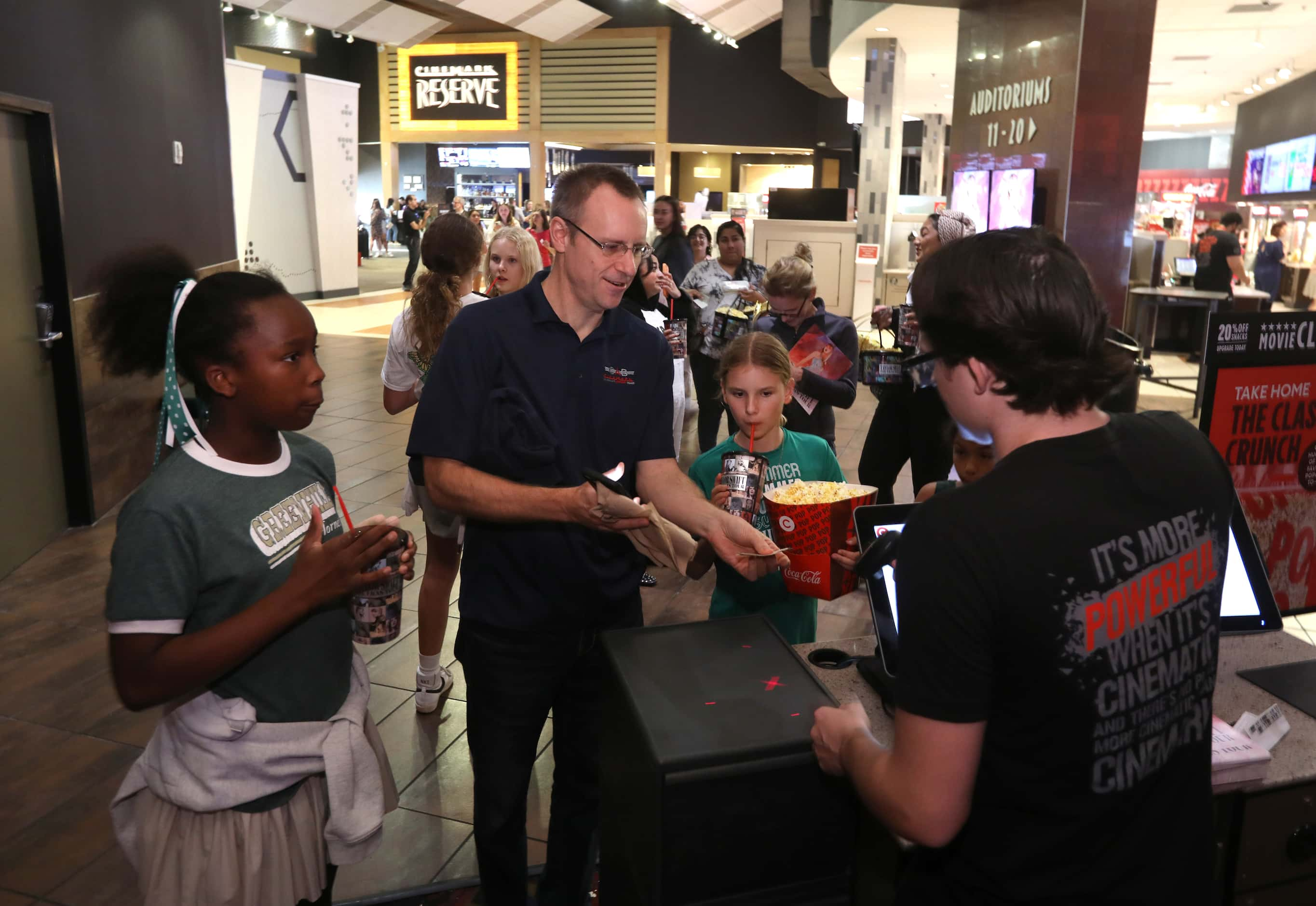 Taylor Swift fans prepare to watch Taylor Swift's movie at Cinemark West Plano XD and...