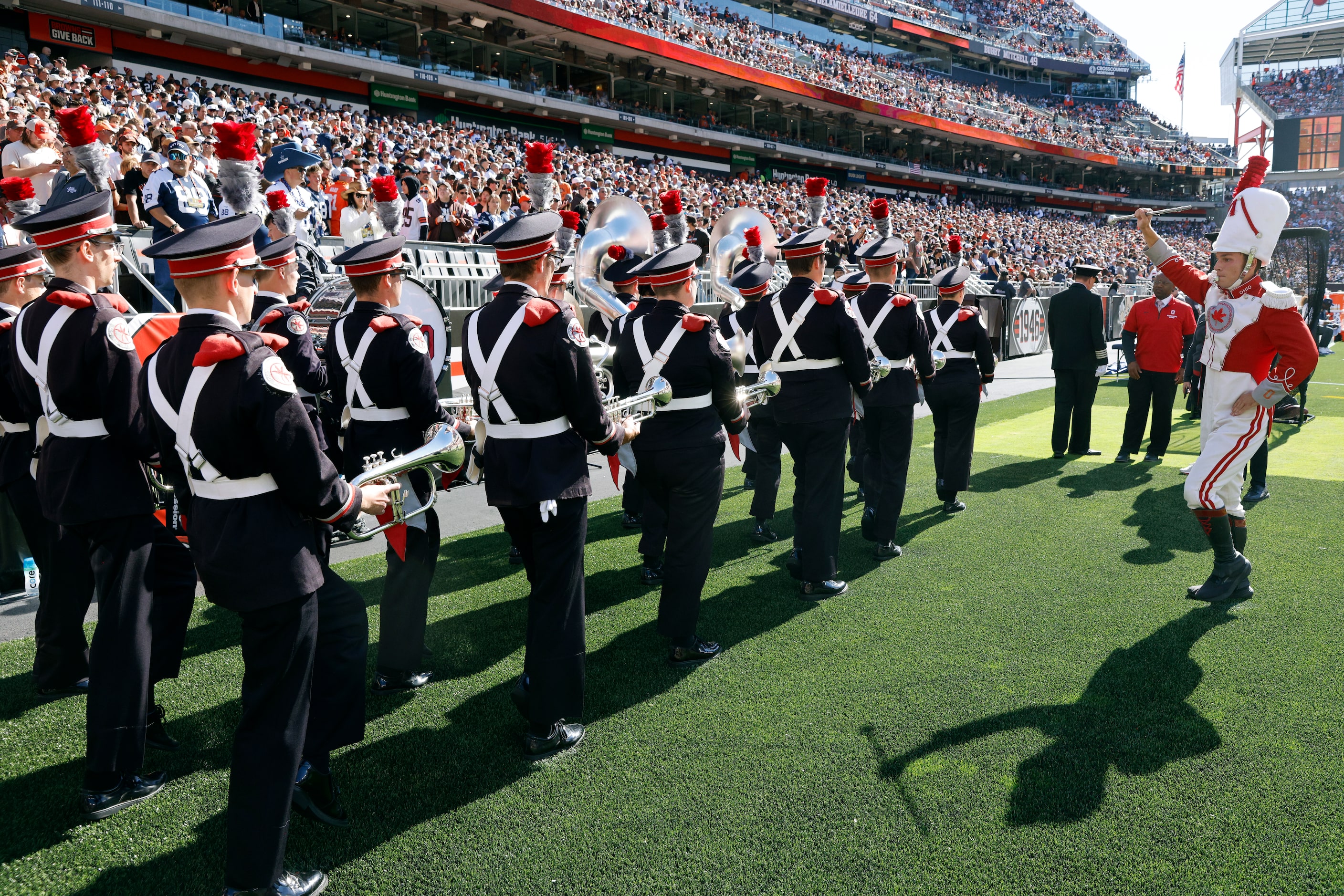 The Ohio State band marches on the sideline before performing before a game between the...