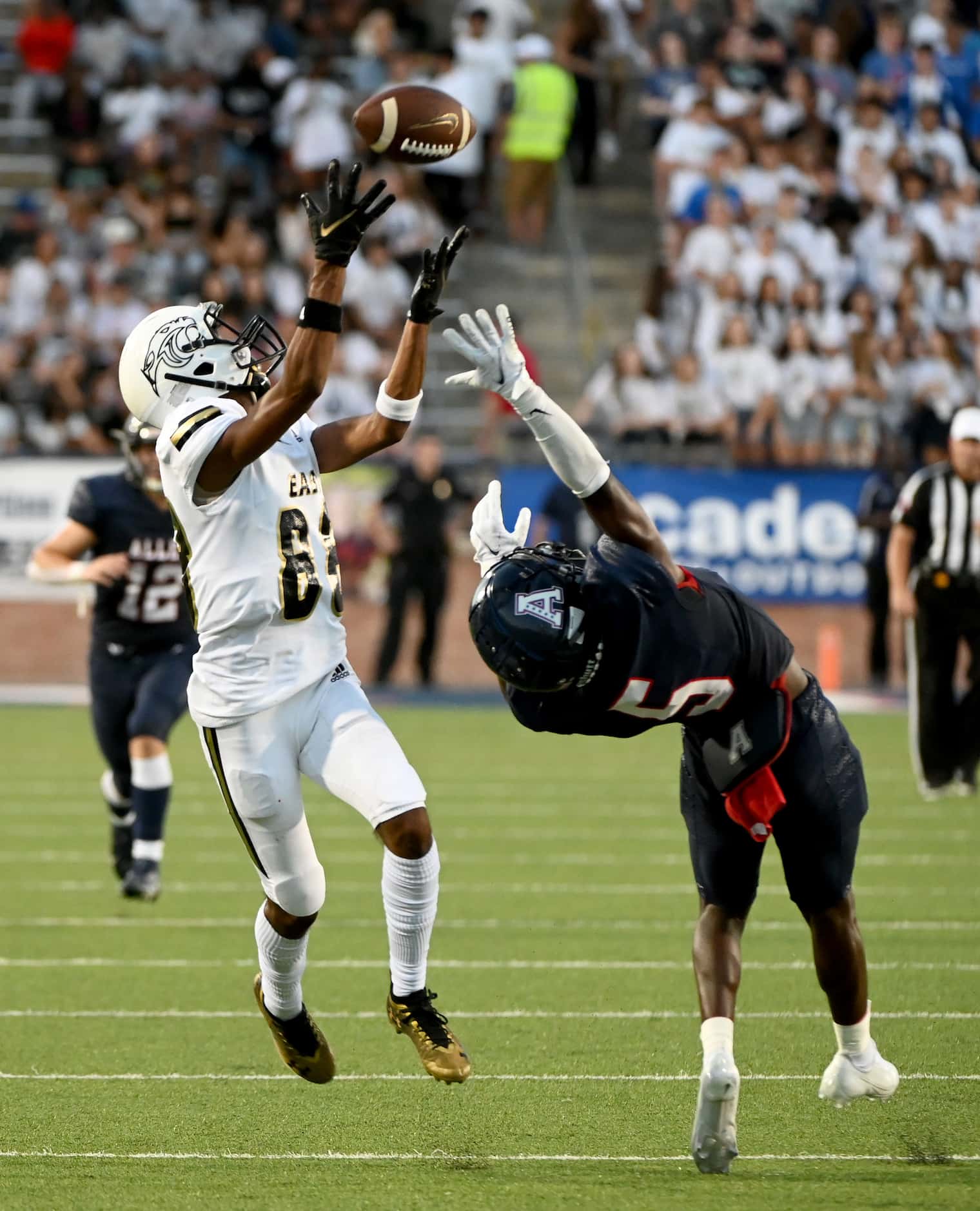 Plano East’s Rushil Patel catches a touchdown pass over Allen’s Sign Shuva (5) in the first...