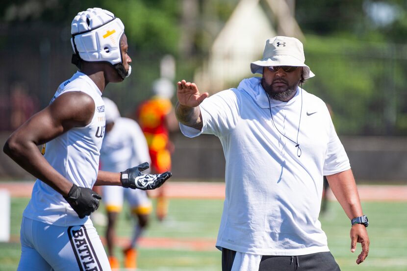 True Buzz coach Bell Cobbs congratulates Tristan Golightly after scoring a touchdown  during...