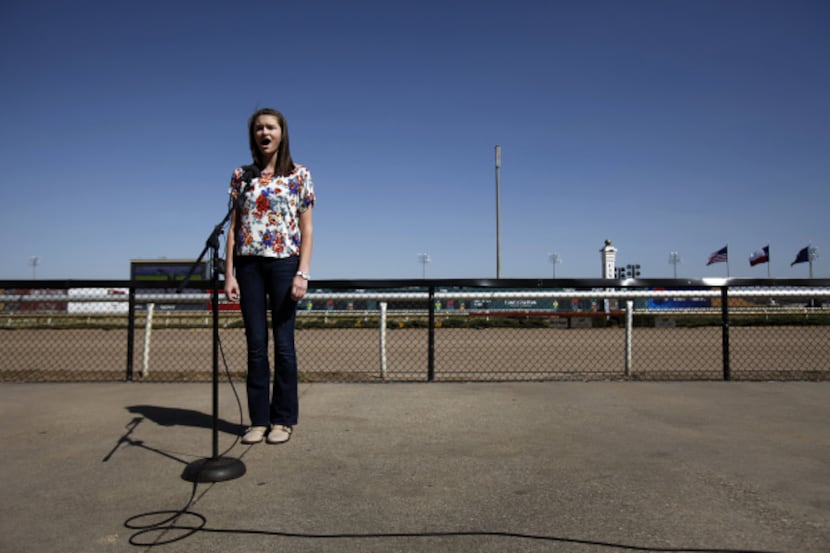 With a clear-blue backdrop, Emilee Vergara, 12, of Colleyville offered her rendition of the...