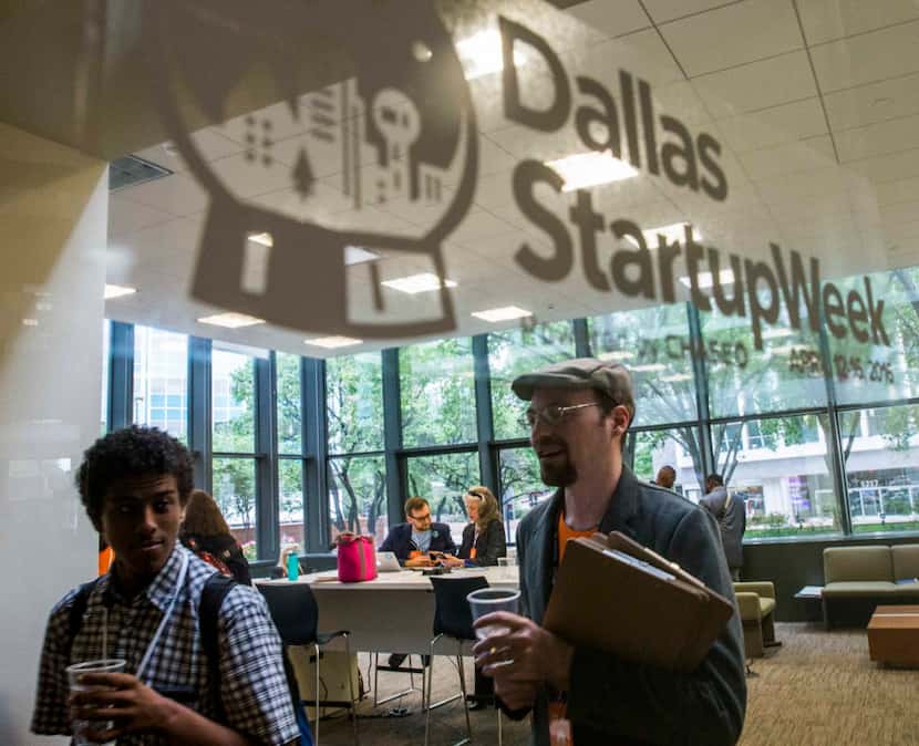 Participants work in a lounge area during Dallas Startup Week activities on Tuesday, April...