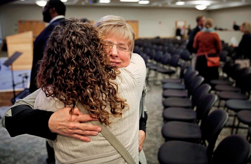 
Nancy Writebol (right) hugged friend Wendy Simpson after her lecture at the Dallas...