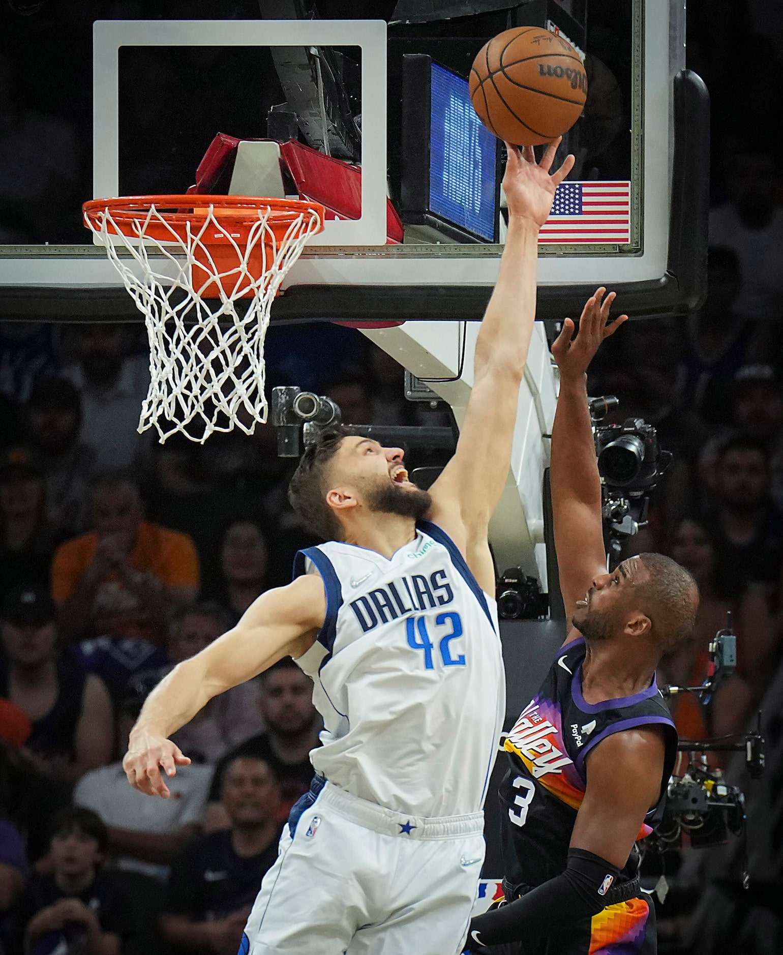 Dallas Mavericks forward Maxi Kleber (42) blocks a shot by Phoenix Suns guard Chris Paul (3)...