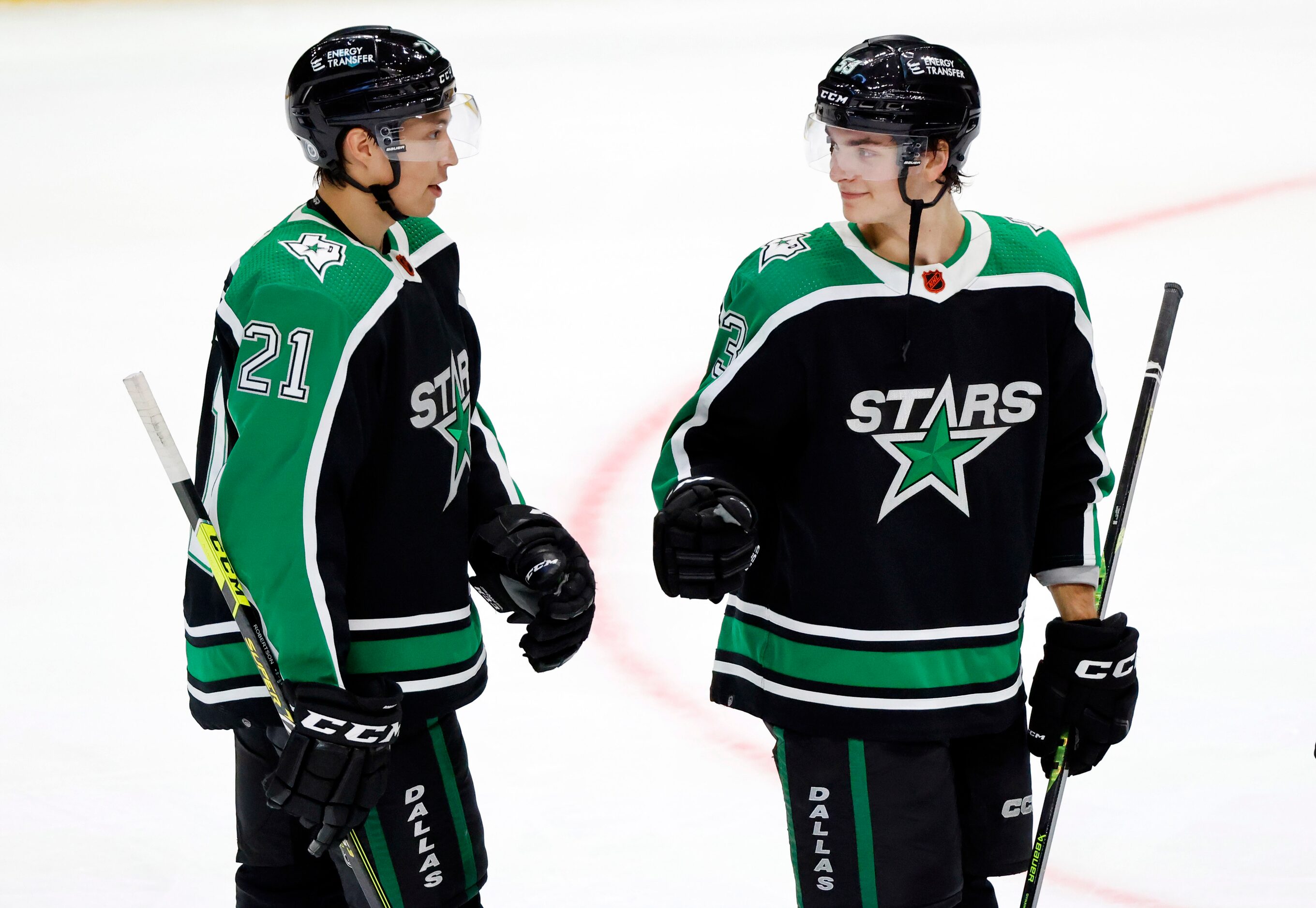 Dallas Stars left wing Jason Robertson (21) and center Wyatt Johnston (53) congratulate one...