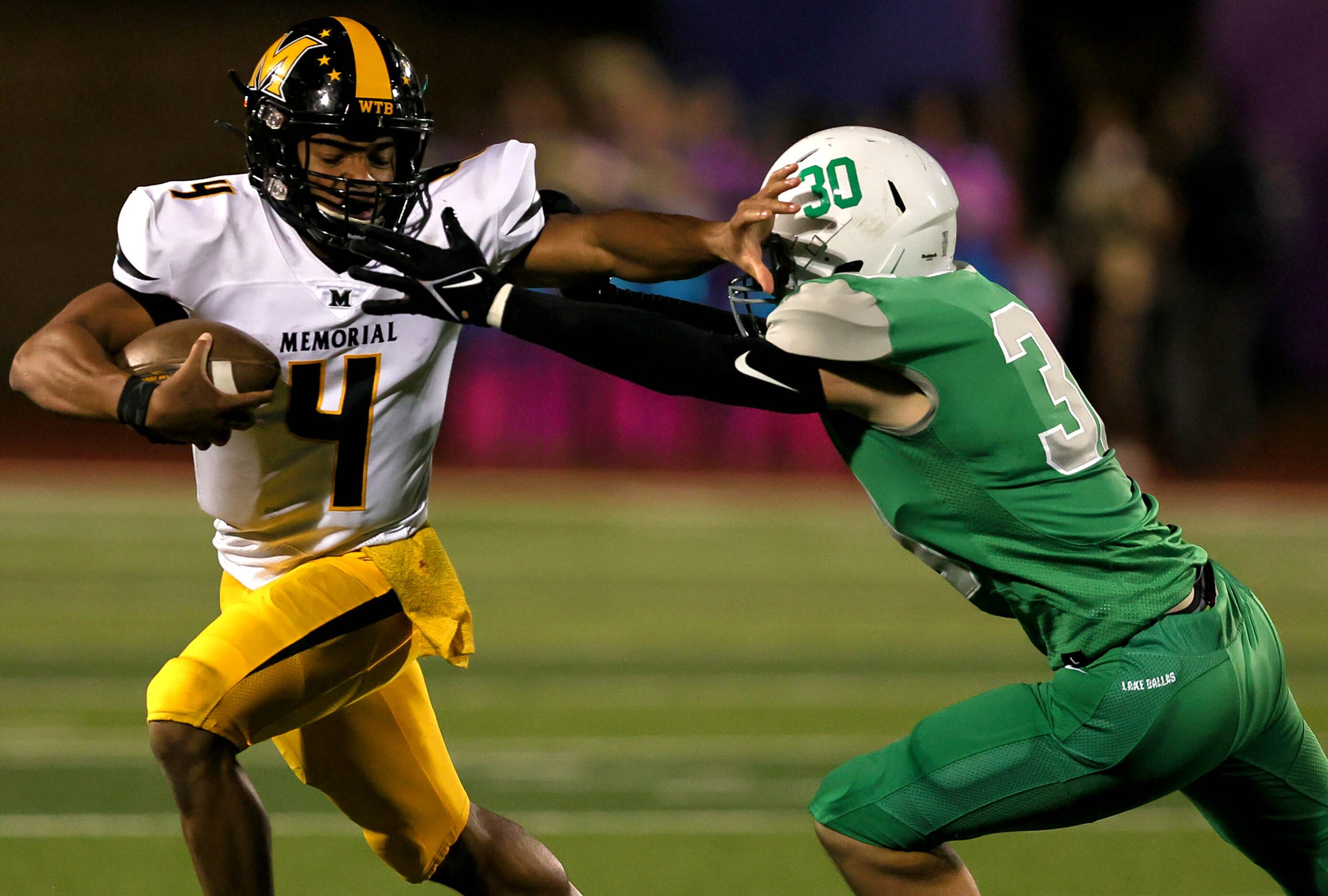 Frisco Memorial quarterback Damarion McPherson (4) tries to avoid Lake Dallas linebacker...