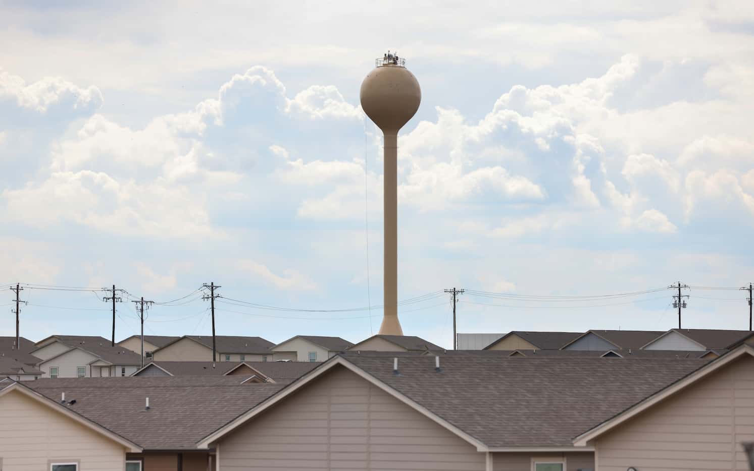 A water tower stands over a neighborhood in Cresson.