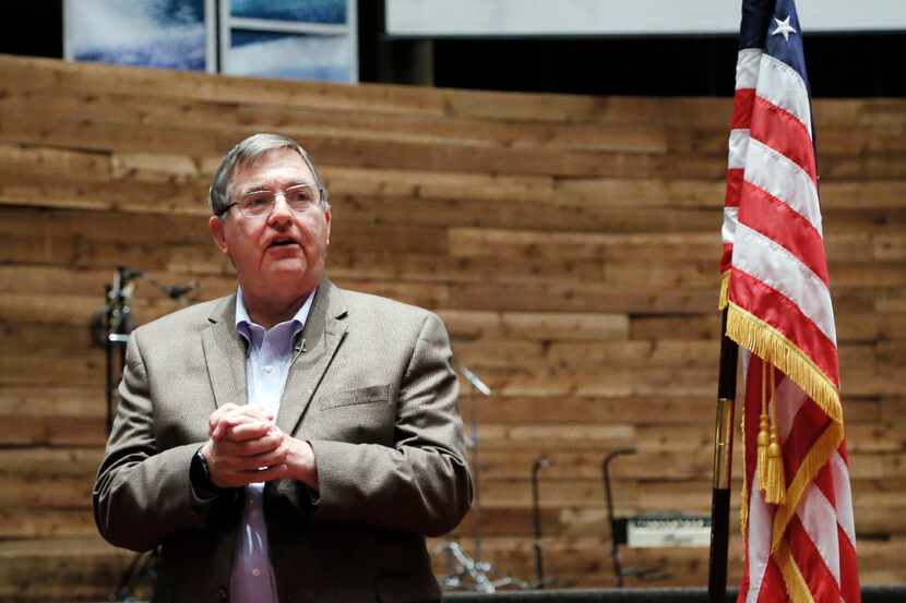 Congressman Michael Burgess took questions from constituents during a town hall meeting at...