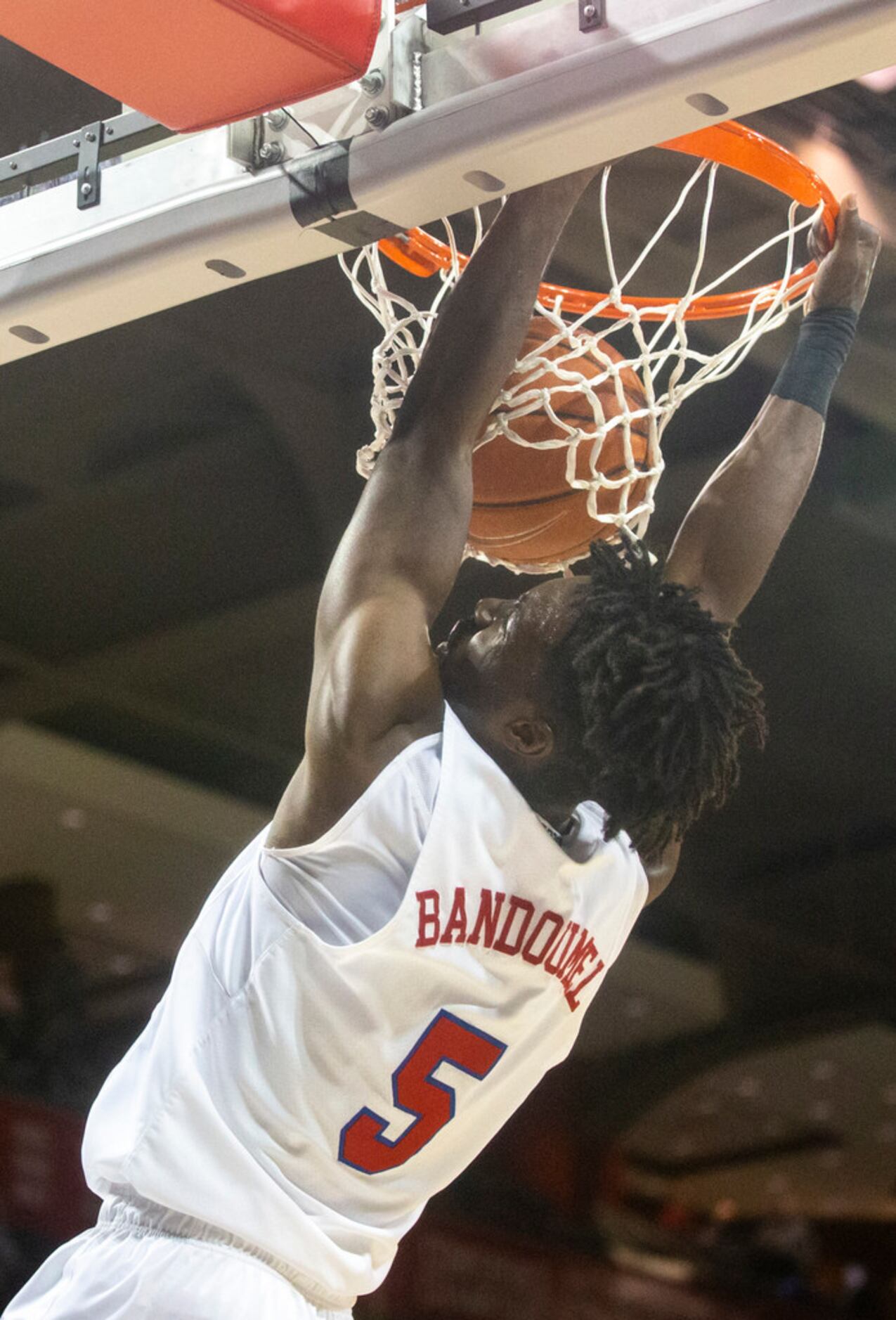 Southern Methodist Mustangs guard Emmanuel Bandoumel (5) dunks the ball during the first...