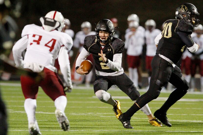 Keller Fossil Ridge quarterback Cobe Craft (2) scrambles for positive yardage towards Keller...