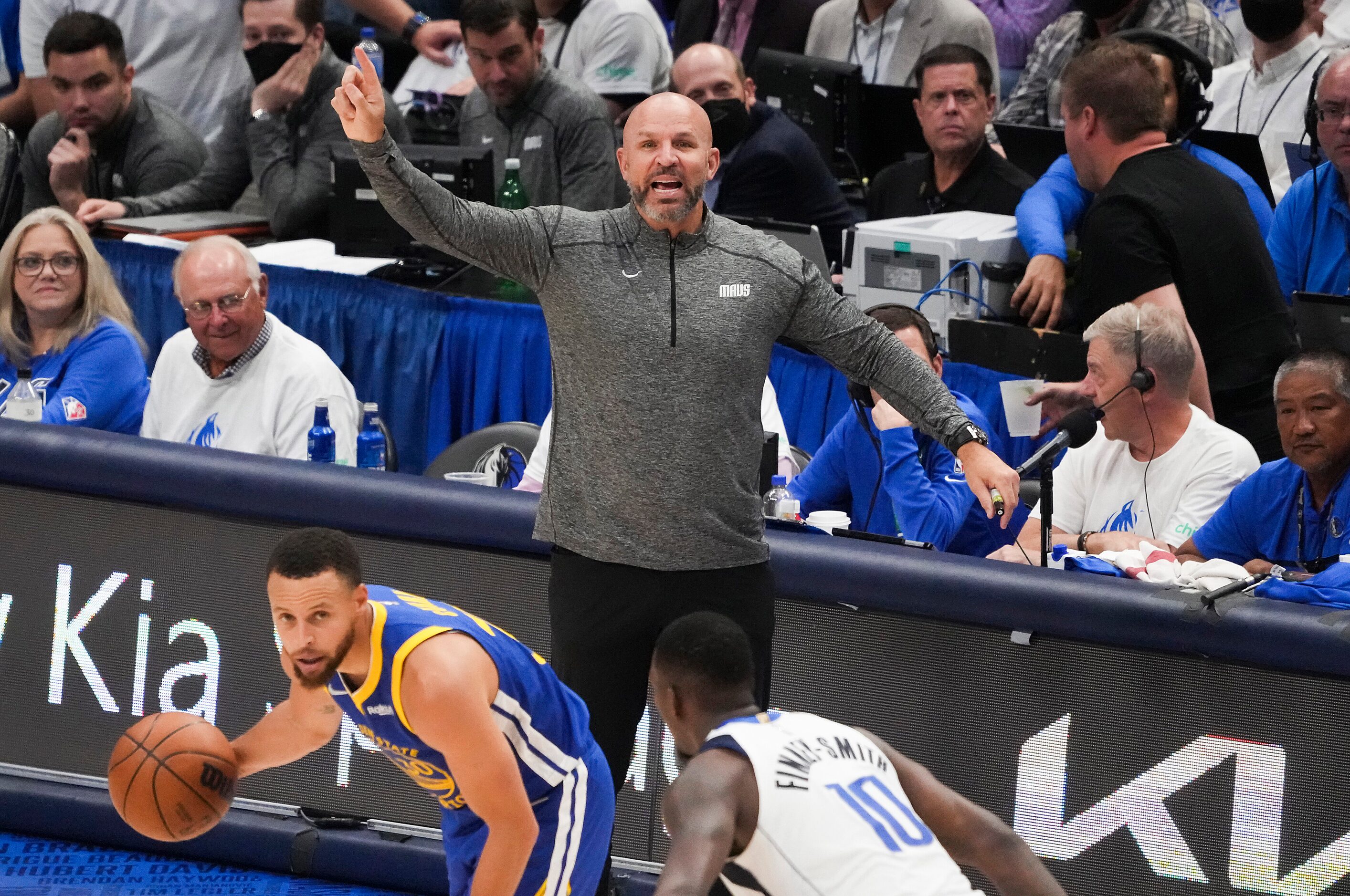 Dallas Mavericks head coach Jason Kidd () calls to his players as forward Dorian...