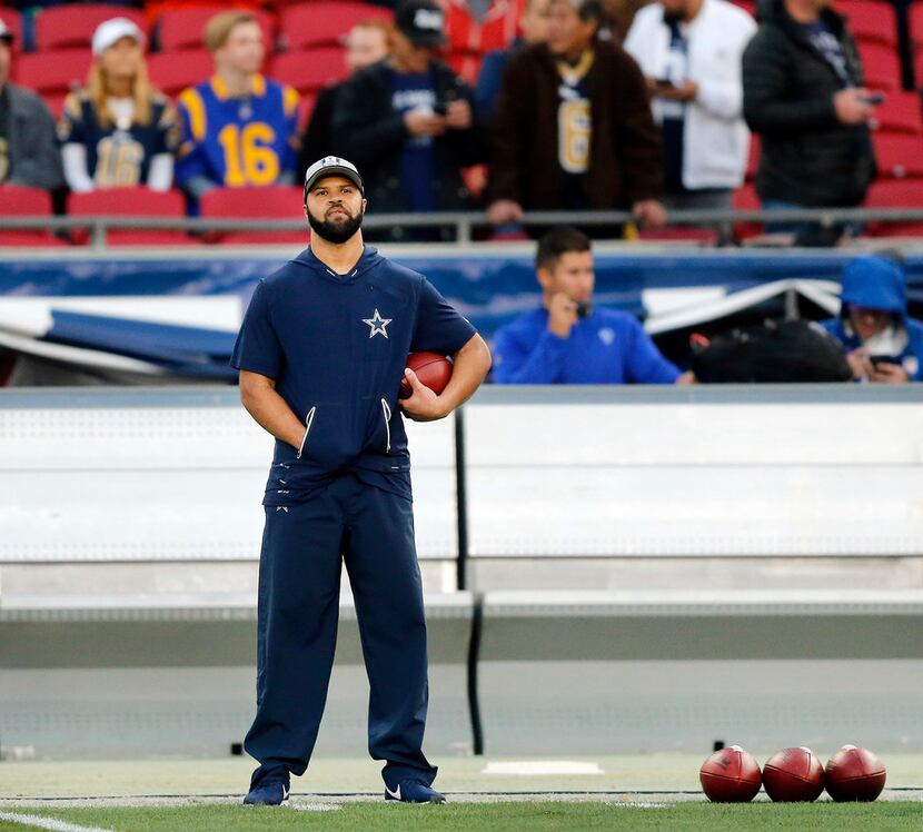 Cowboys assistant coach Kris Richard is seen on the sideline during warmups before an NFC...