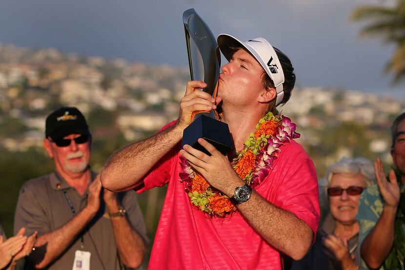 HONOLULU, HI - JANUARY 13:  Russell Henley kisses the Sony Open in Hawaii trophy in...