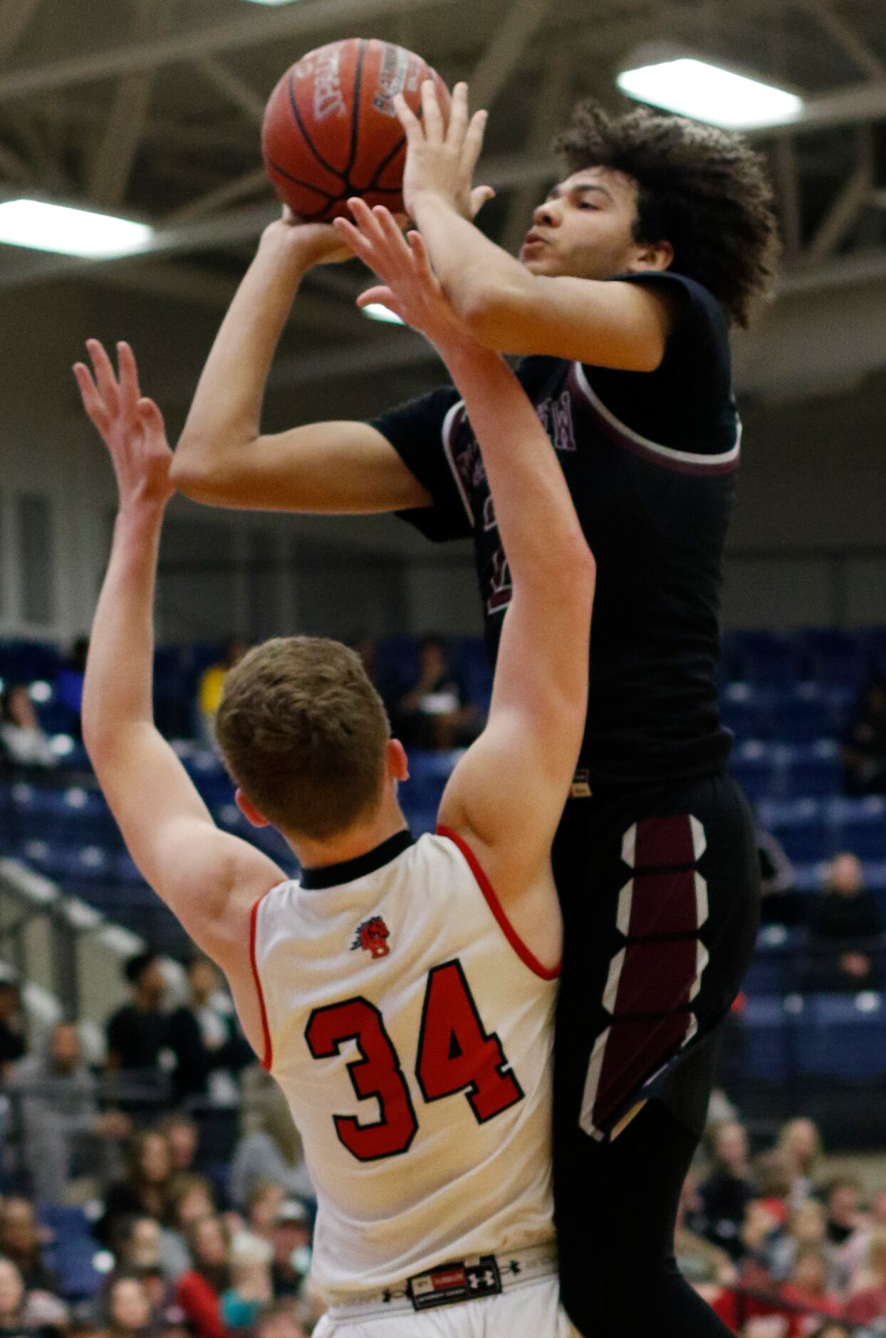 Mansfield Timberview forward Cameron Taylor (2) skies to get off a jump shot over the...