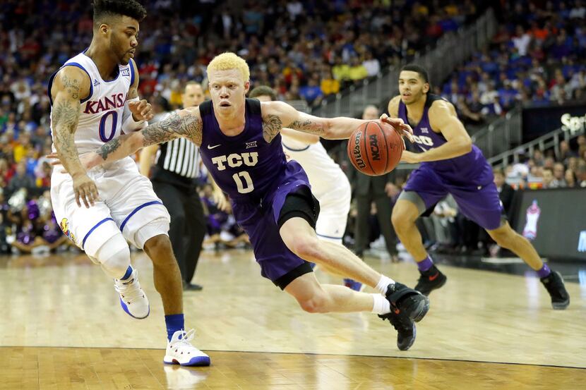 KANSAS CITY, MO - MARCH 09:  Jaylen Fisher #0 of the TCU Horned Frogs drives as Frank Mason...