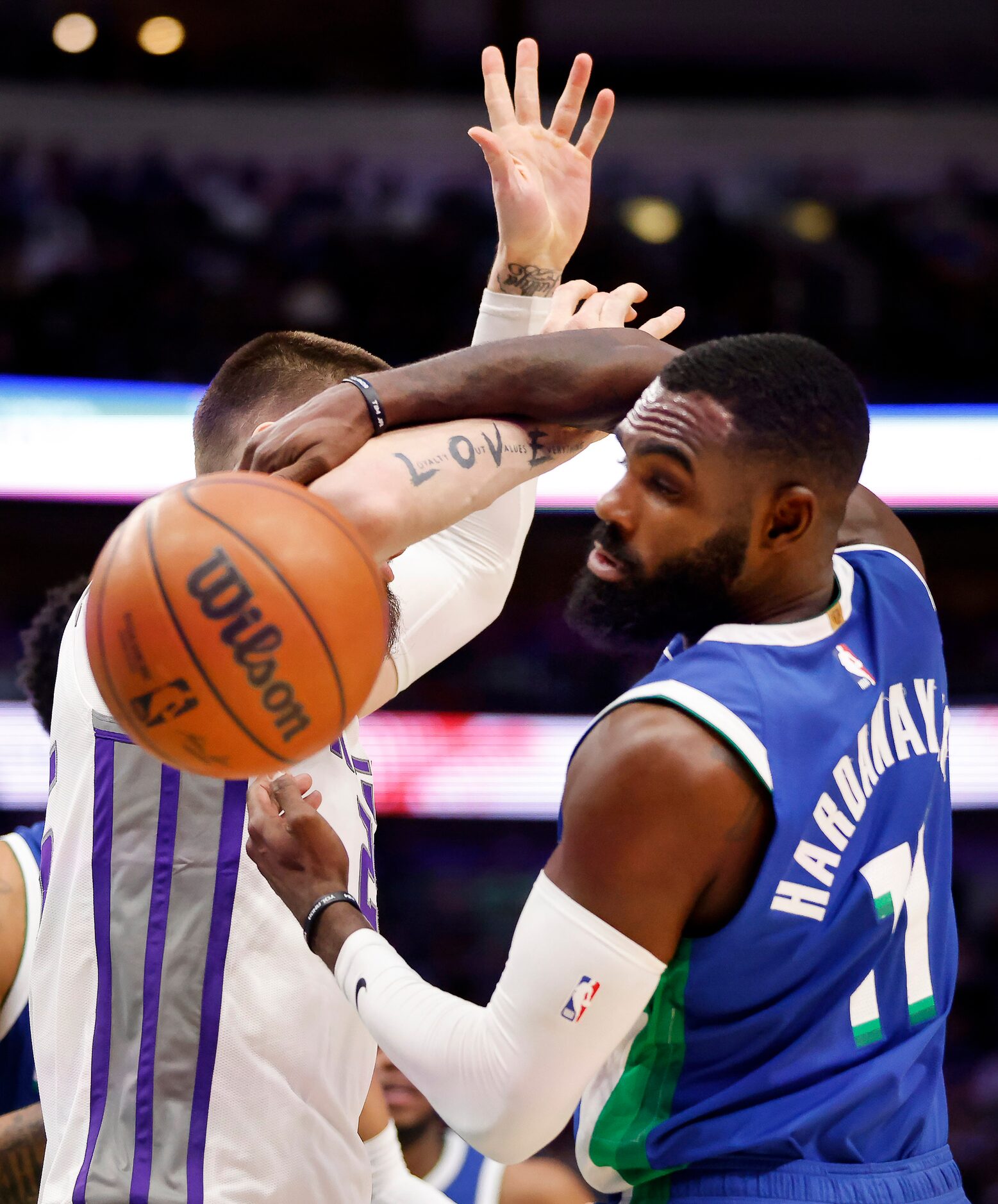 Dallas Mavericks forward Tim Hardaway Jr. (11) battles Sacramento Kings center Alex Len (25)...