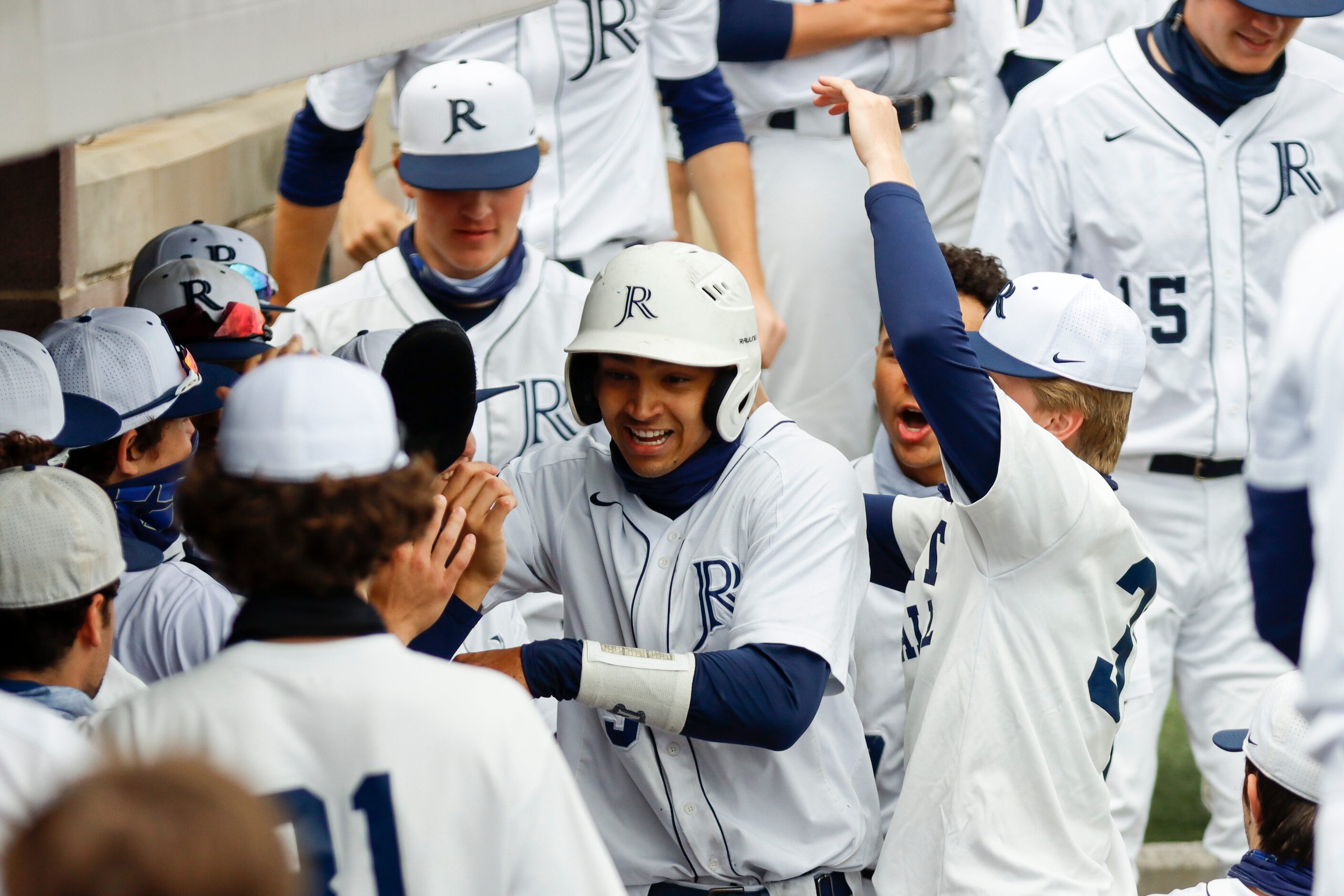 Jesuit celebrates a run scored by shortstop Jordan Lawlar (center) during a district 7-6A...