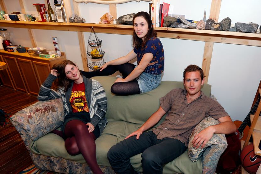 Lara Russo, left, Cally Guasti, center, and Reese Werkhoven sit on a couch in their...