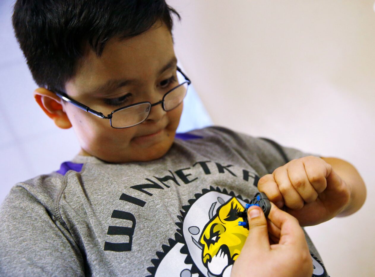 Sebastian Arriola looks for parts at Winnetka Elementary in Dallas as he prepares for the...