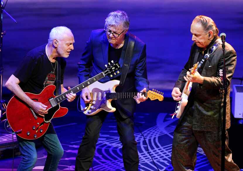 Steve Miller, center, of the Steve Miller Band, performs with Peter Frampton, left, and...