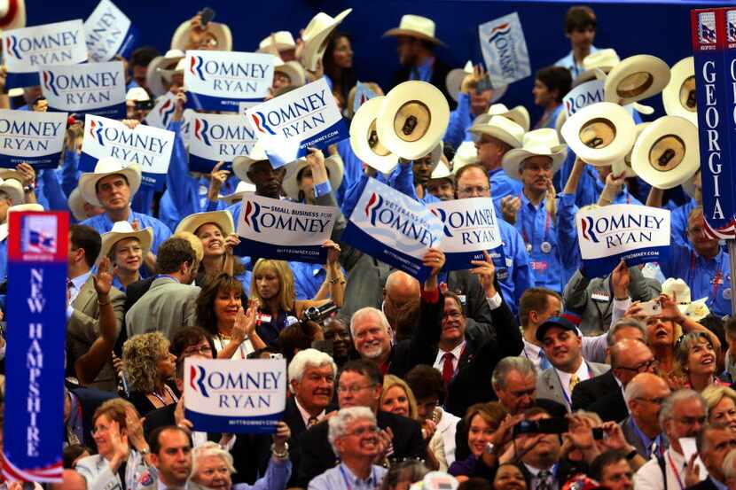 Delegates from Texas, New Hampshire and Georgia show their support for the Romney Ryan...