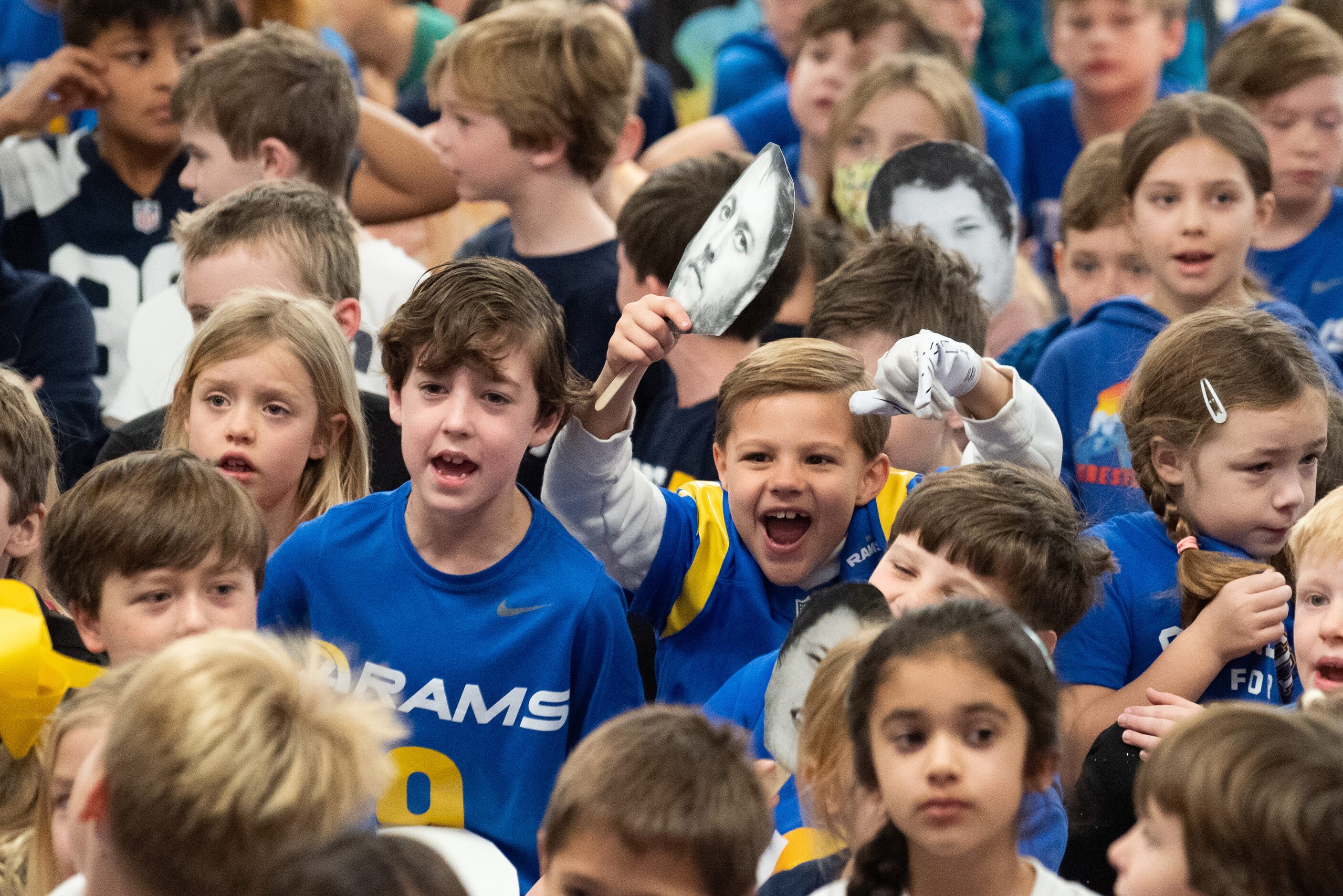 First graders James Cox, left, and Connor Beard, screamed during a pep rally in celebration...