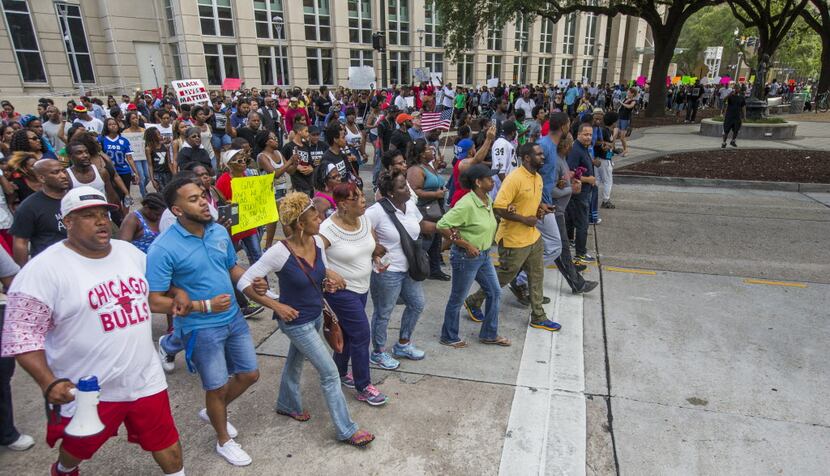 Protesters marched from Baton Rouge City Hall to the Louisiana Capitol on Saturday.