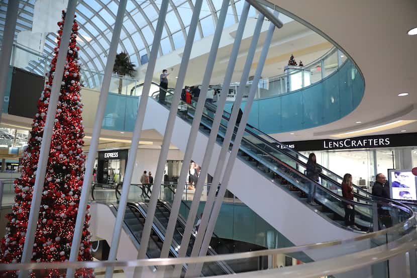 Christmas decorations surround shoppers at the Dallas Galleria mall on November 18, 2021....
